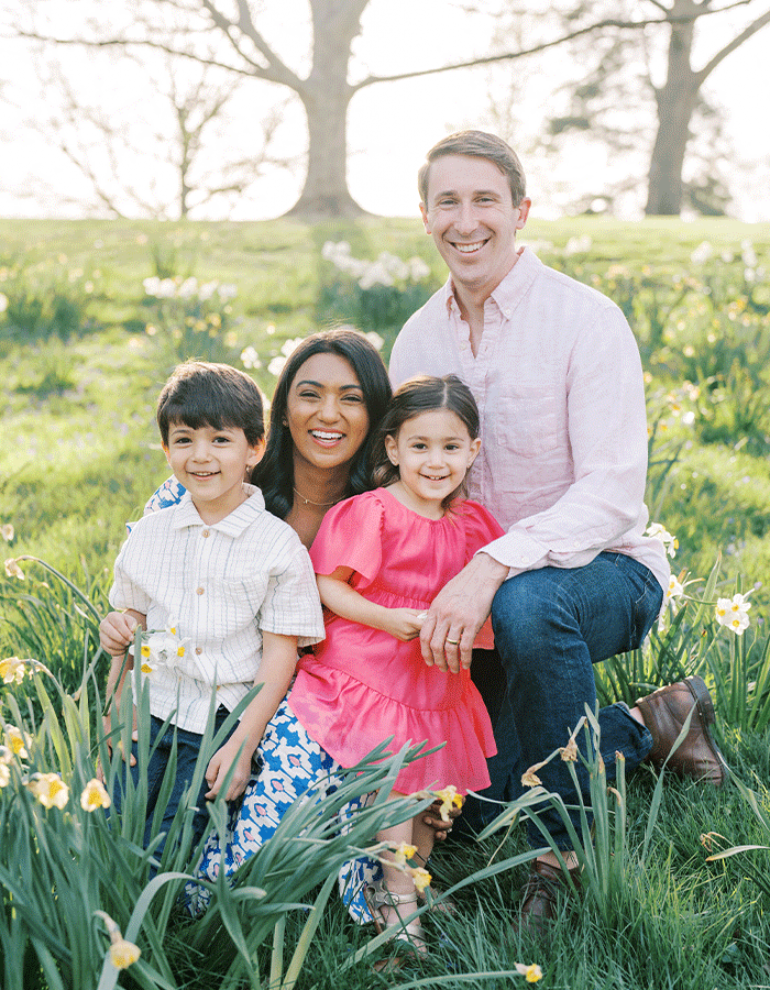Dr. Nisha and Dr. Max Grosel with their children in a family photo.