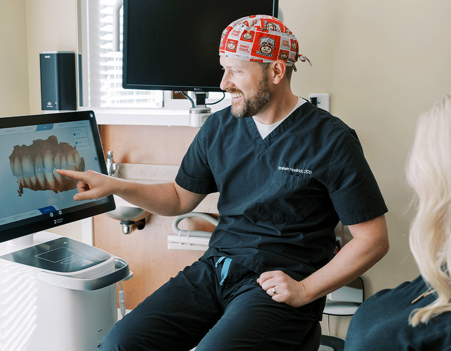 Dr. Hoellrich discussing CEREC® dental scans with a patient.