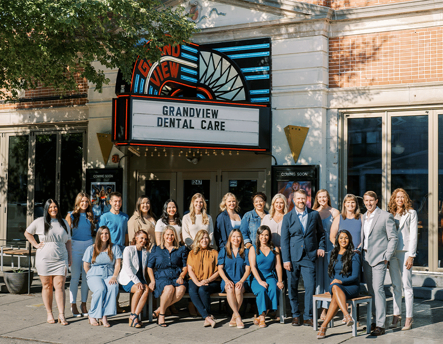 Team photo of the Grandview Dental Care team in front of a vintage theater in Columbus, OH.